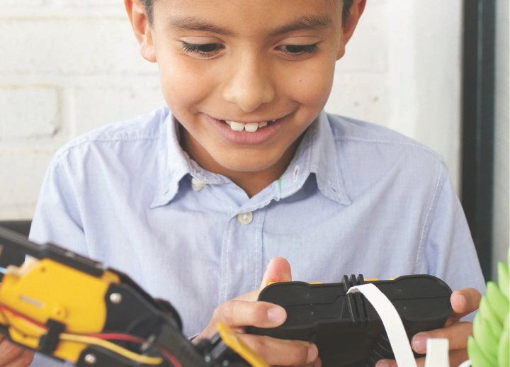 Child playing with robotics