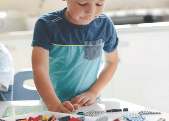 Little boy playing with blocks