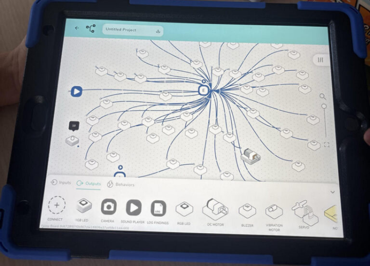 A detail shot of a an ipad with a coding activity working on it.