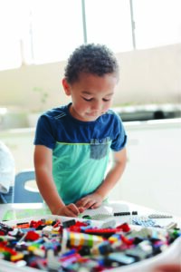 Little boy playing with blocks