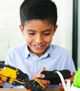 Child playing with robotics
